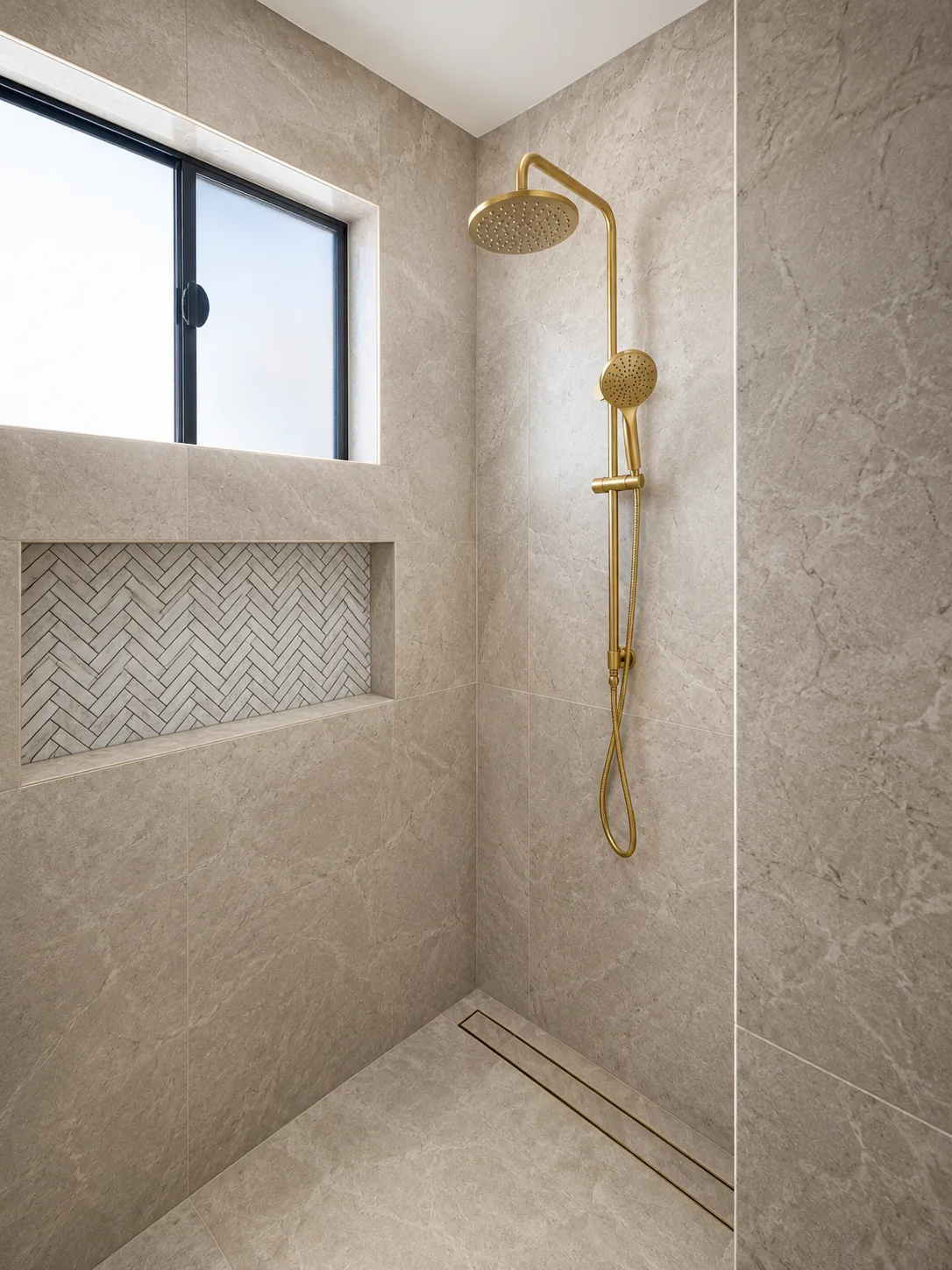Charcoal bathroom with herringbone tiled shower niche and matte black fittings