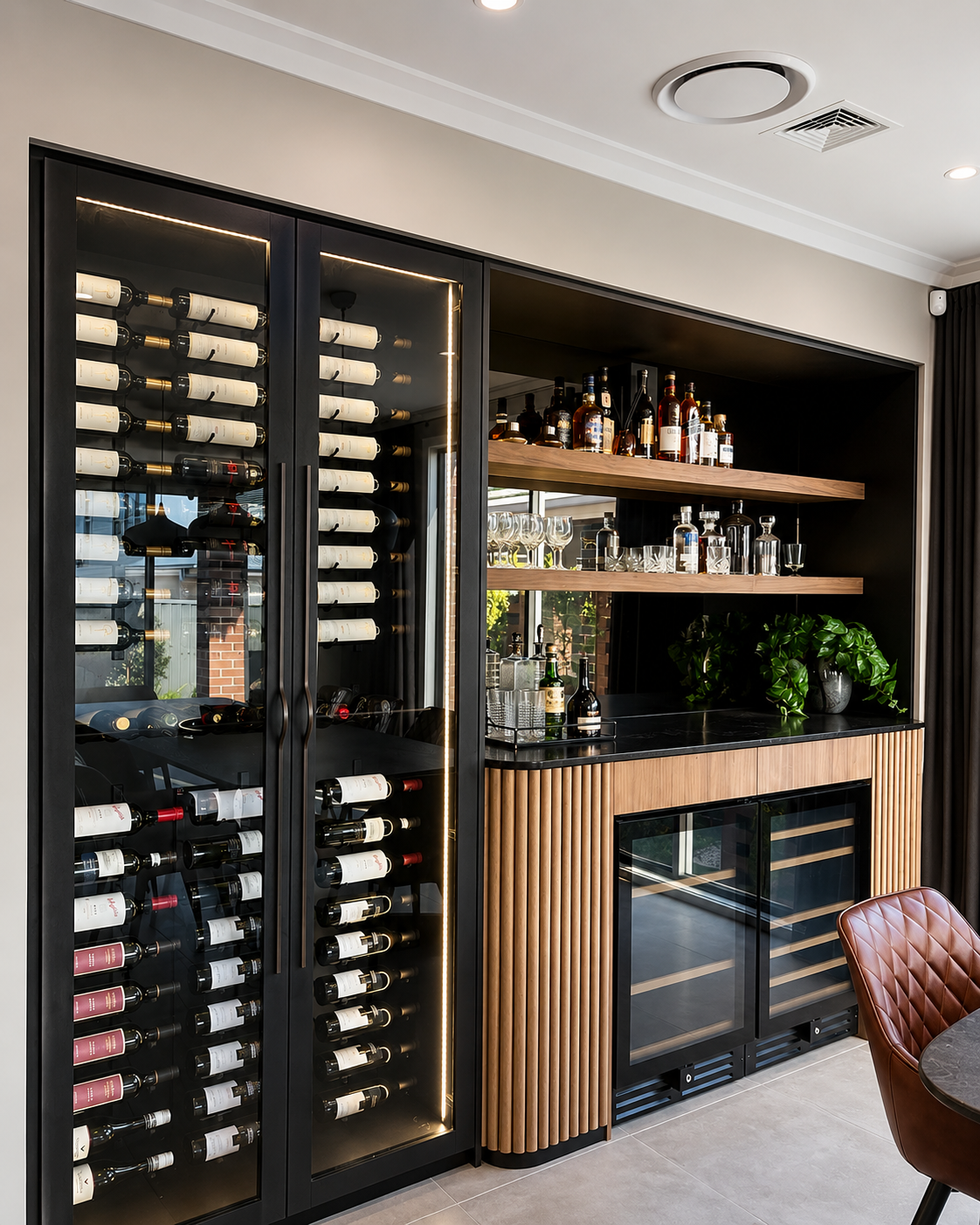 Custom bar joinery with timber battens, shelving and wine storage by Aurum Built